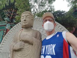 posing with Buddha in Muan, Korea